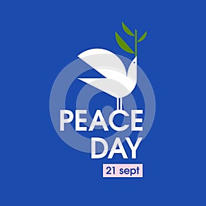 Peace day card with white pigeon with olive branch on a blue