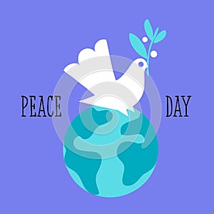 Peace dove with olive branch sitting on Earth planet