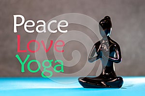 Peace Love Yoga concept. Meditation healthy female figurine in peace, soul and mind zen balance concept