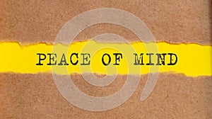 PEACE OF MIND written under torn paper