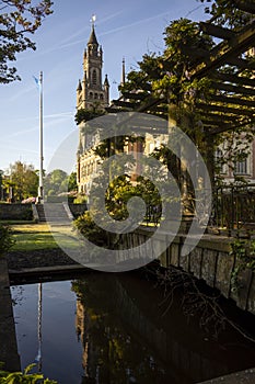 Peace Palace behind a woodland, Vredespaleis, under a pure gradient blue sky, seat of the ICJ, International Court of Justice, photo