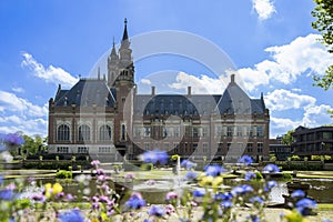 Peace Palace fountain and garden reflected on the calm water