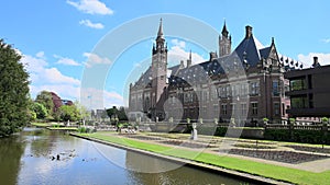 Peace Palace fountain and garden reflected on the calm water