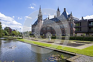 Peace Palace and garden reflected on the calm water