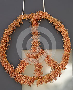 a peace sign as decoration with flowers