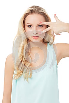 Peace sign, eyes and portrait of woman on a white background with confidence, pride and attitude. Fashion, beauty and