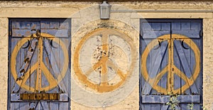 Peace sign repeated symbol on abandoned building