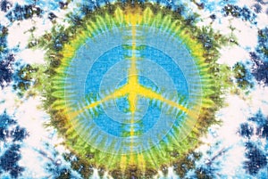 Peace sign tie dyed pattern on cotton fabric for background.