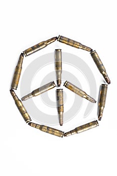 Peace symbol formed by old bullets, abstract concept