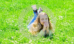 Peace and tranquil concept. Girl on hopeful dreamy face spend leisure outdoors. Child enjoy spring sunny weather while