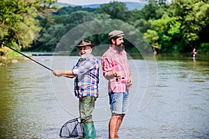 Peaceful activity. Nice catch. Rod and tackle. Fisherman fishing equipment. Fisherman grandpa and mature man friends