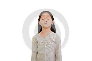 Peaceful Asian little girl closed eyes and Raise head up isolated on white background. Portrait of kid with long black hair, Front