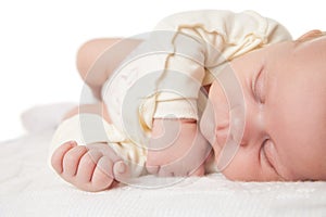 Peaceful baby lying on bed while sleeping