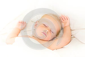 Peaceful baby lying on a bed sleeping