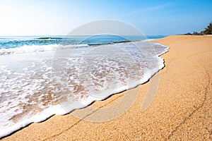 A peaceful beach scene in Thailand, exotic tropical beach landscapes and blue sea under a blue background. Relaxing summer holiday