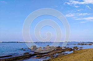 Peaceful beach at the start of the day. Clear blue sky. Located in Los Cobanos, Sonsonate, El Salvador