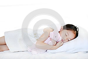 Peaceful beautiful Asian child girl sleeping on bed