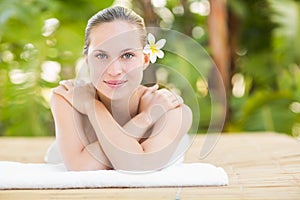 Peaceful blonde lying on towel