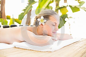 Peaceful blonde lying on towel