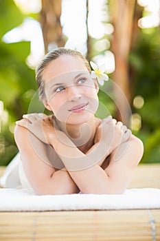 Peaceful blonde lying on towel