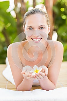 Peaceful blonde lying on towel