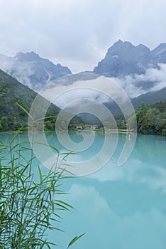 peaceful blue lake with mountain background after rain