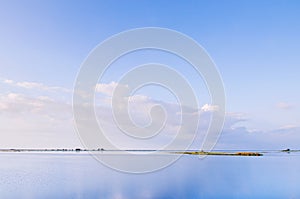 Peaceful calm lake Nong Han with blue sky. Sakon Nakhon - Thailand