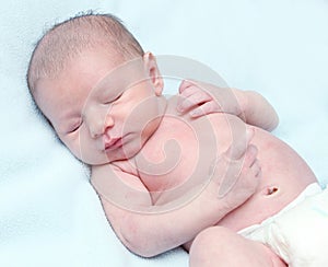 Peaceful chubby sleeping newborn baby