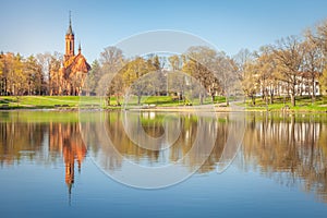 Peaceful city park and church on the lake Druskonis, lithuania