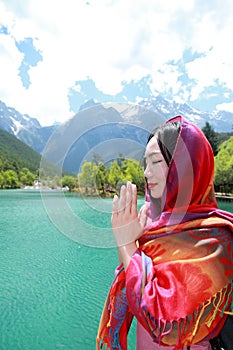 Peaceful happy life, careless Asian Chinese woman prey by a lake