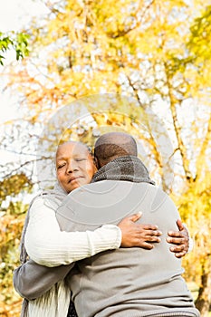 Peaceful happy senior couple embracing