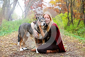 Peaceful Happy Woman Hugging German Shepherd Dog While Walking i