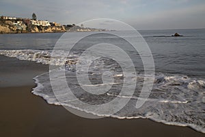 Peaceful horizontal landscape of a Pacific Ocean beach sand and