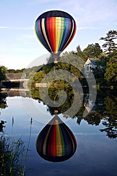 Peaceful Hot Air Balloon over river in Vermont