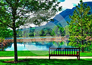 A Peaceful and Idyllic Image at the Broadmoor Hotel at Cheyene Mountain Lake and bench