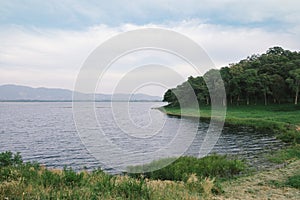 Peaceful lake in cloudy day