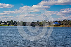 Peaceful Lake Murray Water Landscape Yacht Building Blue Roof Sun photo