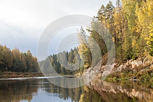 Peaceful landscape with Gauja river and white sandstone outcrops photo