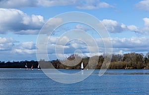 Peaceful landscape with lake and fishing boats