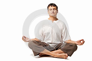 Peaceful man meditating isolated over white