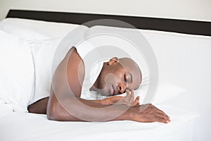 Peaceful man sleeping in bed