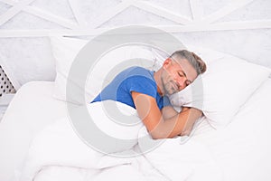 Peaceful mature man relaxing. Good Sleep is Reachable Dream. World Sleep Day. Benefits of good and healthy sleep photo