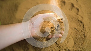 A peaceful moment captured in time, as hands gently work the soil