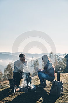 Peaceful morning. Beautiful young couple having morning coffee w