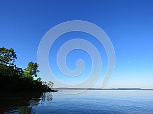 Peaceful morning, lake at dawn, calm lake background with trees