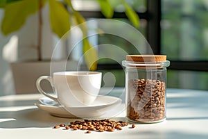 Peaceful morning scene featuring .glass jar filled with ground coffee, white coffee cup on sunlit table. Play of light, shadows