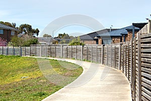 Peaceful pedestrian path adorned with a classic fence