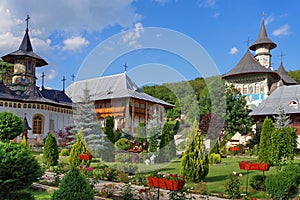 Spring landscape. Orthodox church - Monastery Bujoreni, landmark attraction in Romania photo