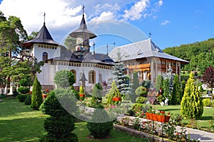 Orthodox church - Monastery Bujoreni, landmark attraction in Romania. Spring landscape