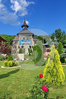 Spring landscape. Orthodox church - Monastery Bujoreni - landmark attraction in Vaslui County, Romania photo